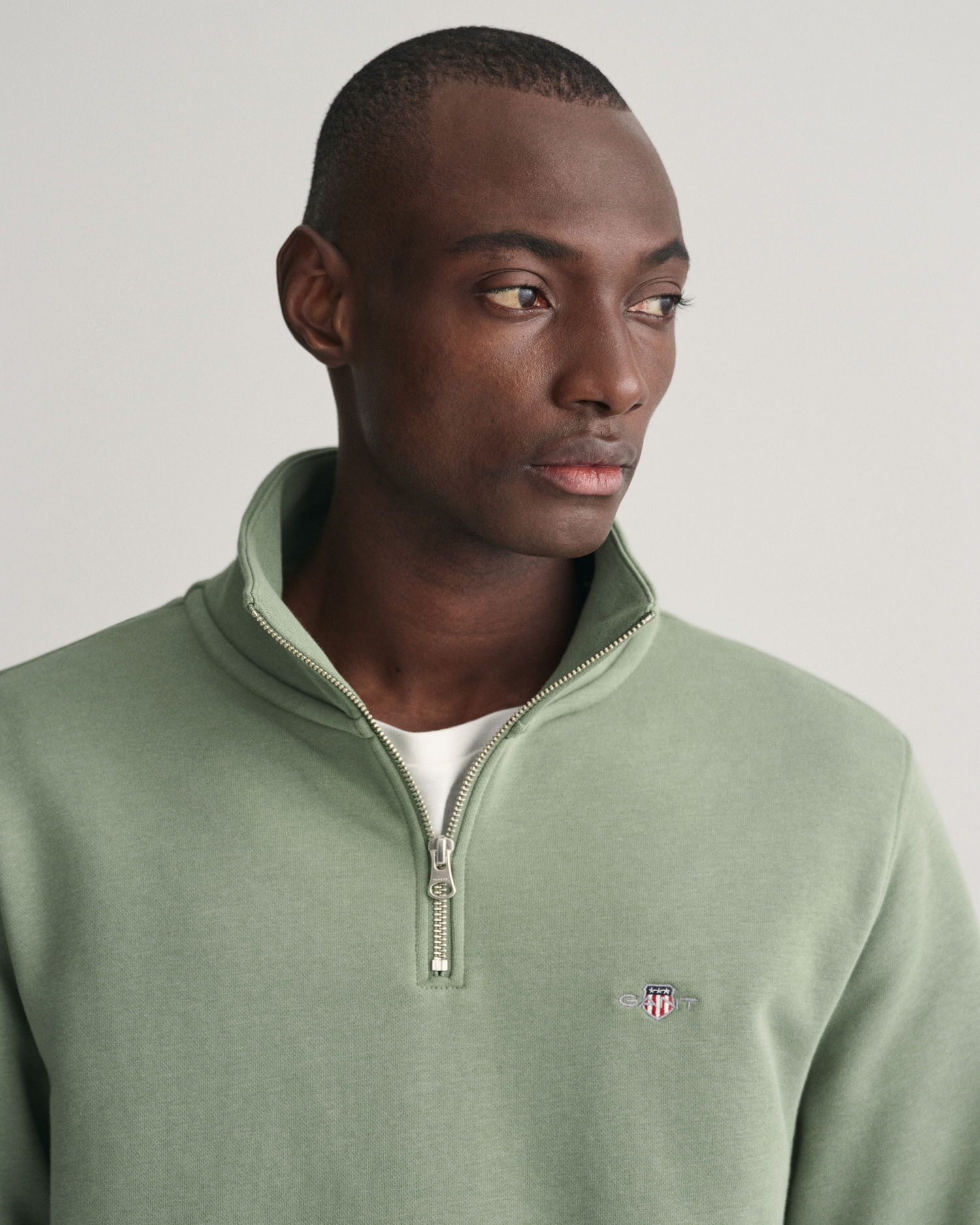 Shield collegegenser med half-zip