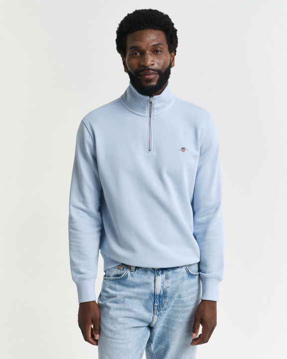 Shield collegegenser med half-zip