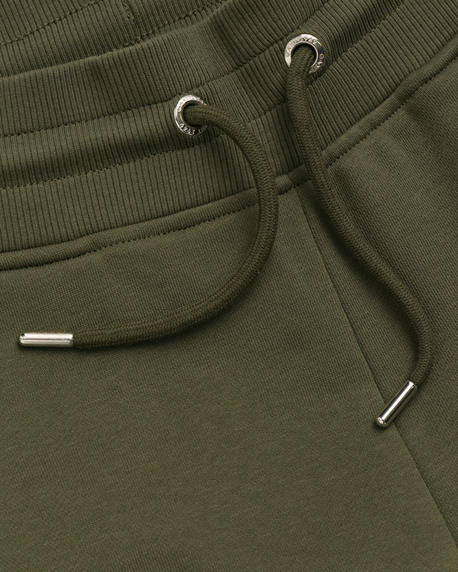 Joggebukser med liten shield-logo