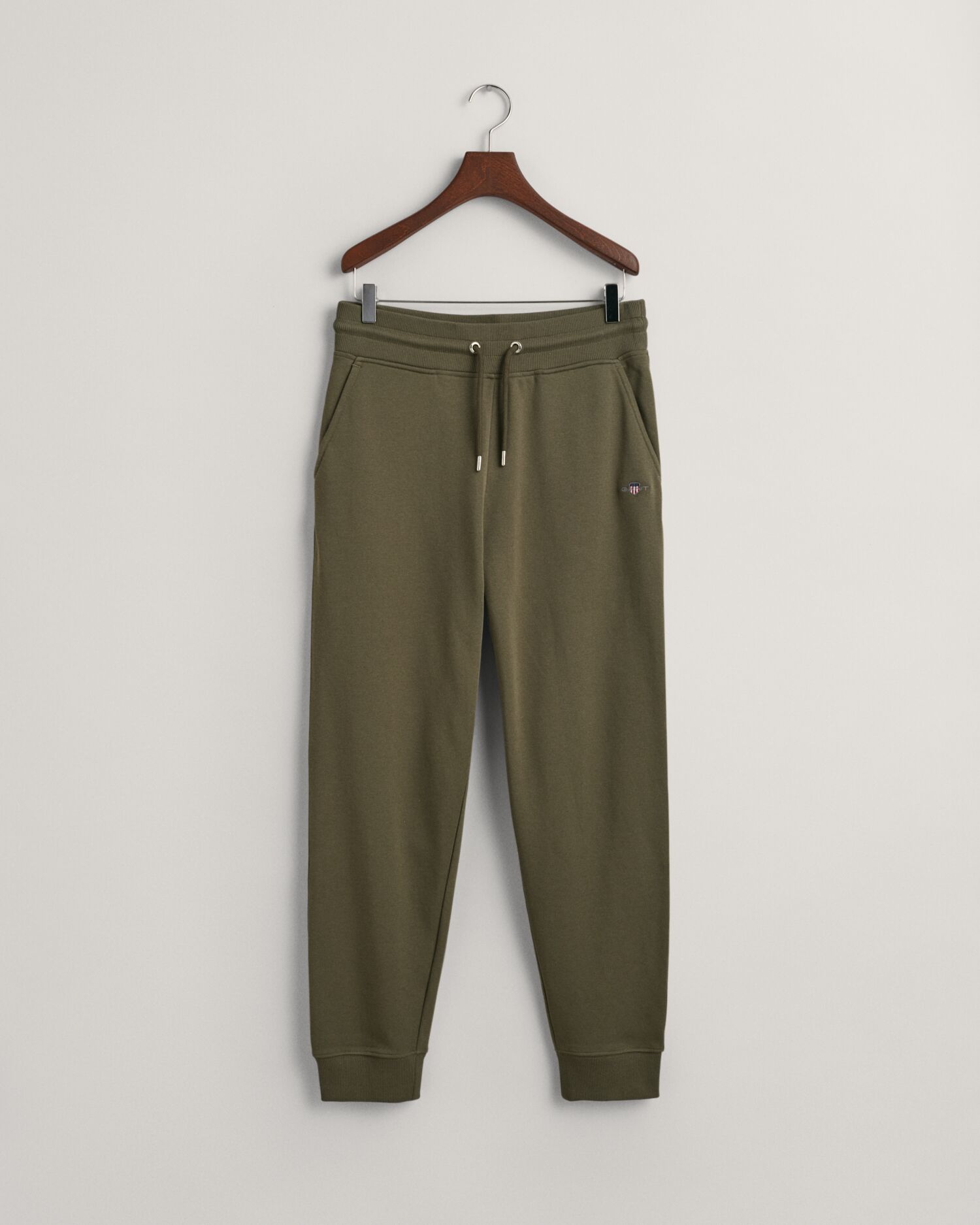 Joggebukser med liten shield-logo